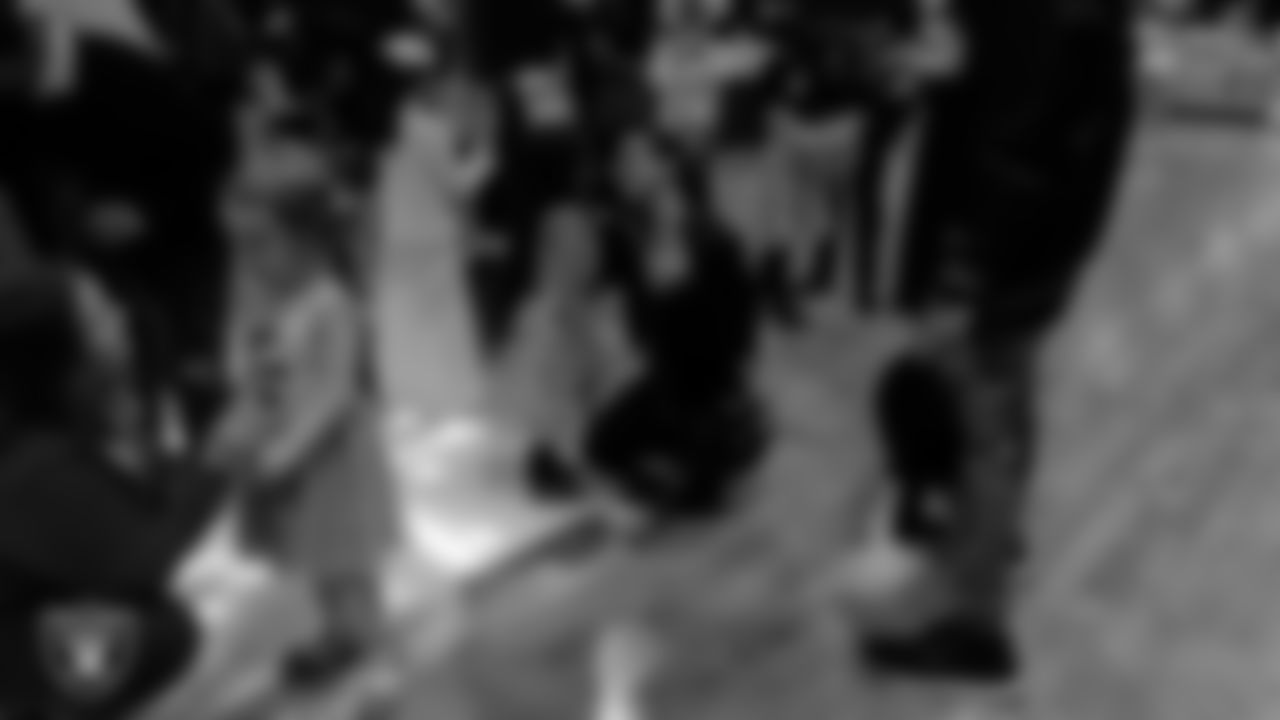 Attendees exchange roses during the Valentine's Day Dance at The Studio.