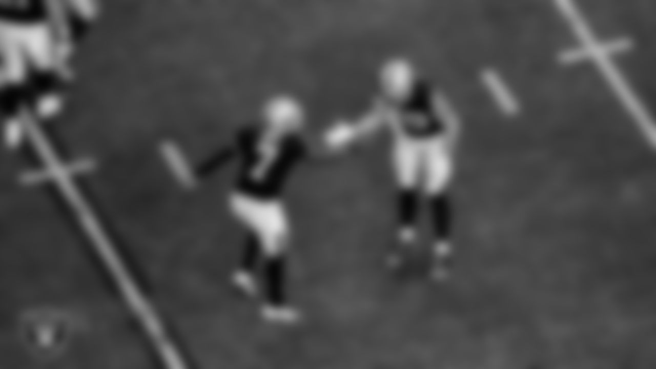 Las Vegas Raiders tight end Brock Bowers (89) celebrates with quarterback Geno Smith (7) after making a 15-yard touchdown catch during the regular season home game against the Denver Broncos at Allegiant Stadium.