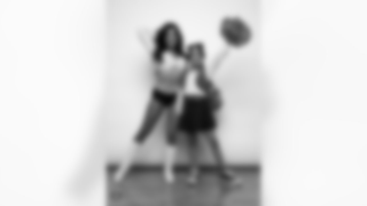 Raiderette Tatiana poses for a photo with a Junior Raiderette during 2025 Media Day at The Studio.