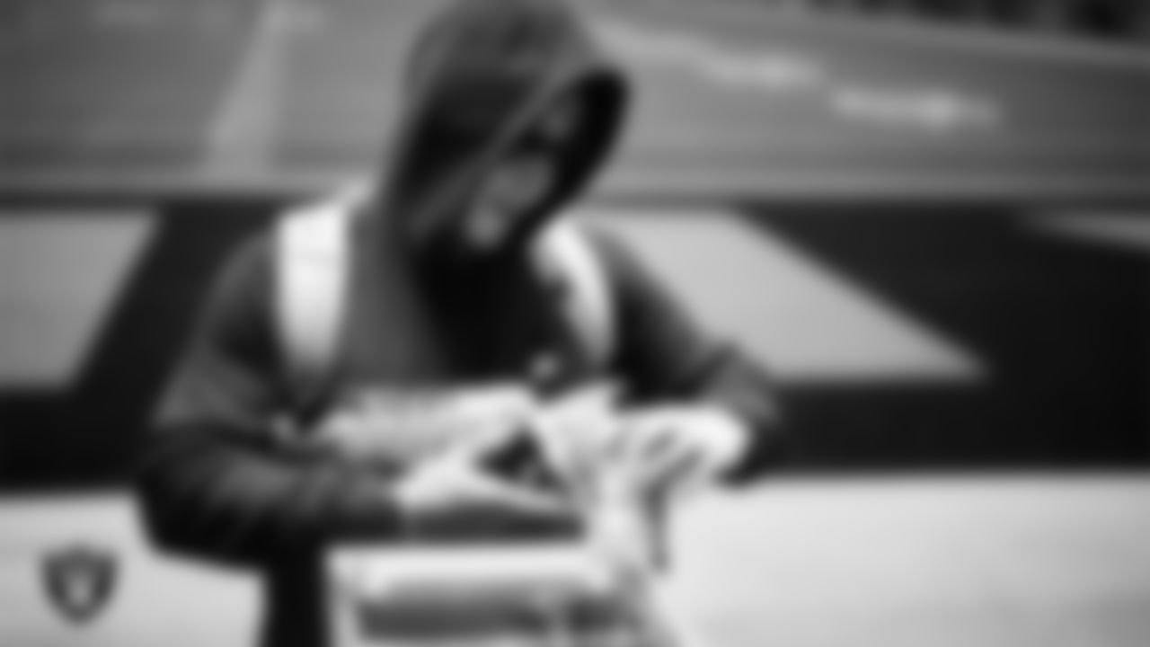 Las Vegas Raiders wide receiver Jack Bech (18) unboxes his custom cleats for the NFL's My Cause My Cleats initiative at Intermountain Health Performance Center.