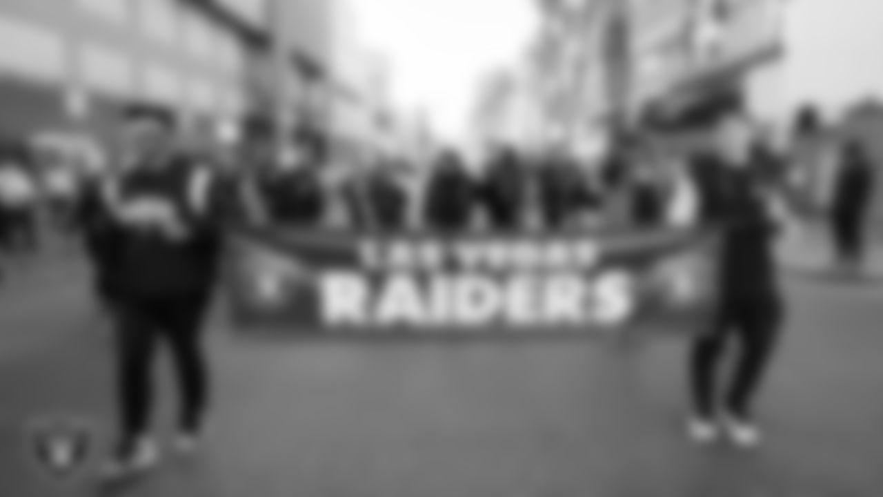 Raider Image planning specialist Jason Brown and Las Vegas Raiders coordinator of event operations Marcus Castillo during the Martin Luther King Jr. Day Parade in Downtown Las Vegas.
