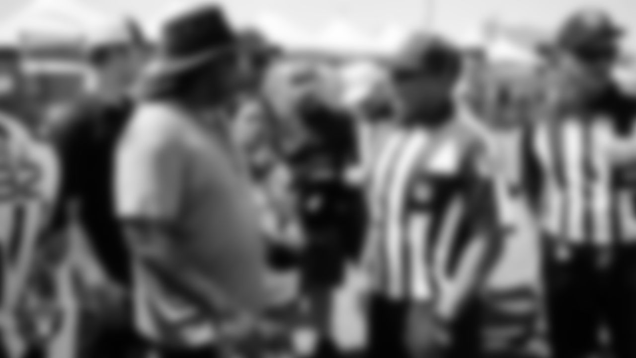 Members of the Southern Nevada Officials Association meet with NFL official Shawn Hochuli and his crew after a 2025 Training Camp practice at Intermountain Health Performance Center.