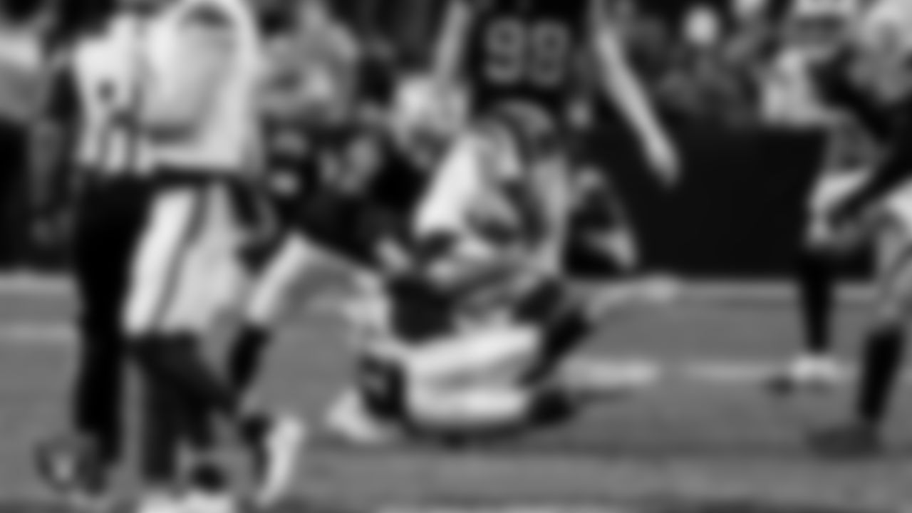 Las Vegas Raiders cornerback Darien Porter (26) and safety Jeremy Chinn (11) during the regular season home game against the Denver Broncos at Allegiant Stadium.