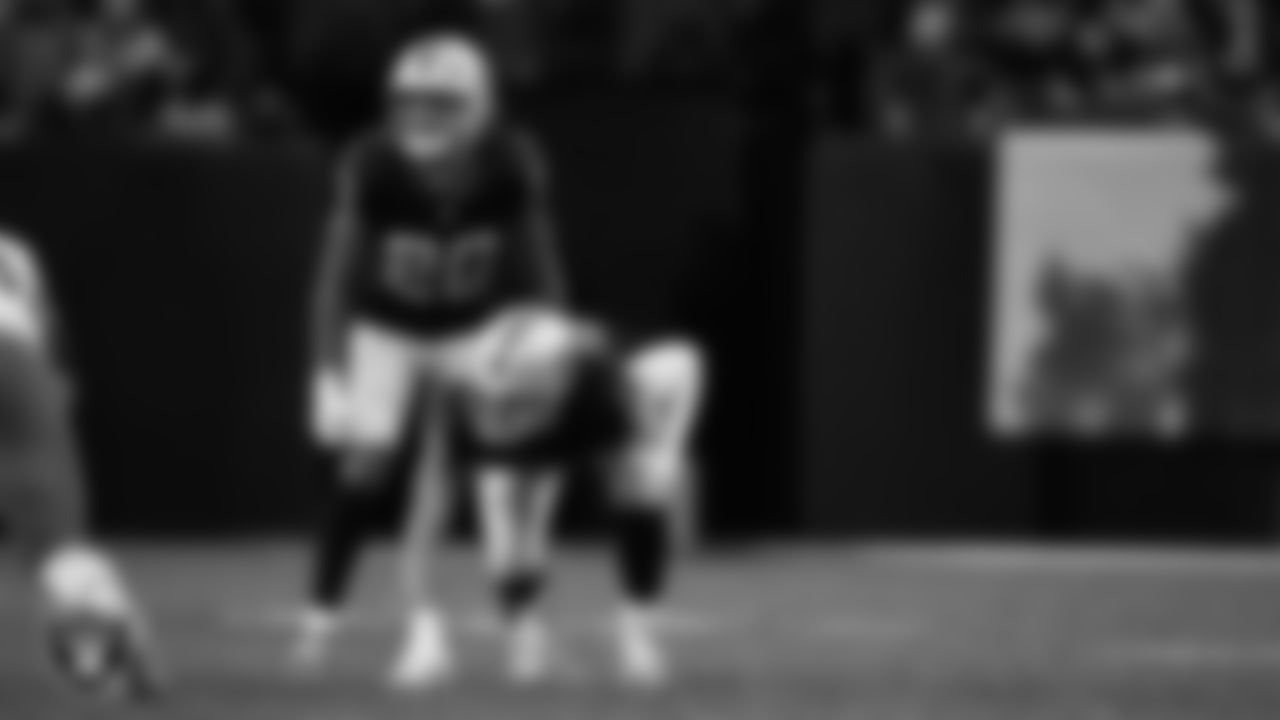 Las Vegas Raiders safety Isaiah Pola-Mao (20) and defensive end Maxx Crosby (98) line up before the snap during the regular season home game against the Cleveland Browns at Allegiant Stadium.