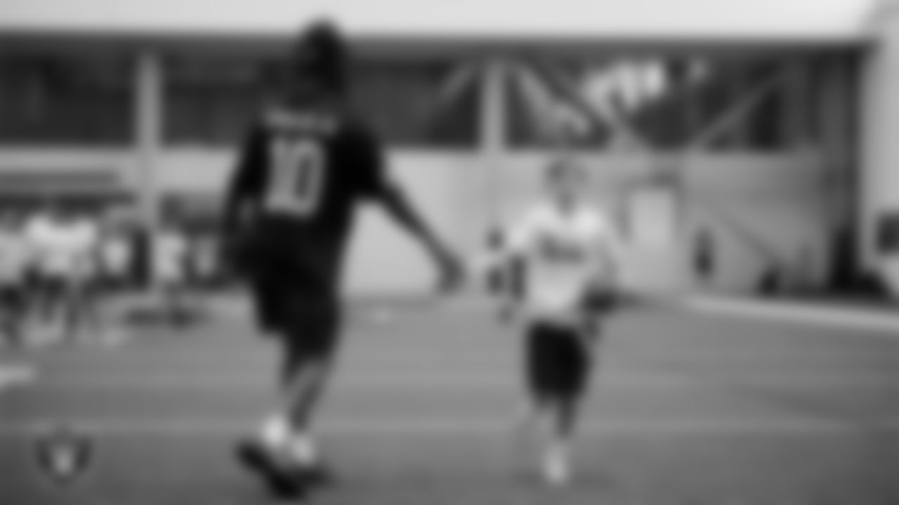 Las Vegas Raiders wide receiver Dont'e Thornton Jr. (10) works with athletes at a skills camp during Play Football Day at Intermountain Health Performance Center.