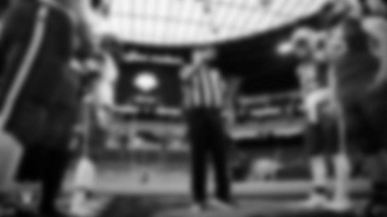 Athletes during the coin toss before the NIAA 2A Division State Championship game between Needles High School and Pershing County High School at Allegiant Stadium.