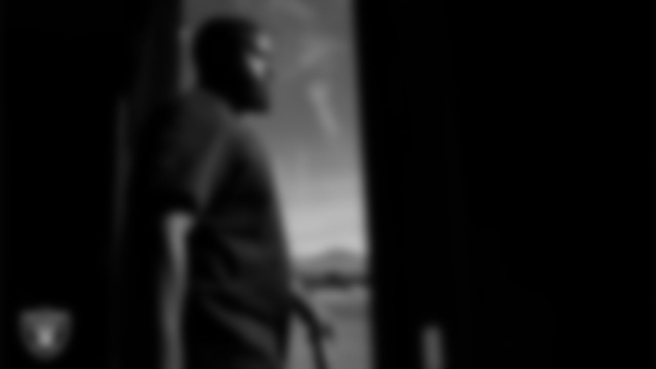 Las Vegas Raiders assistant defensive line coach Kenyon Jackson walks out to the field for practice at Intermountain Health Performance Center.