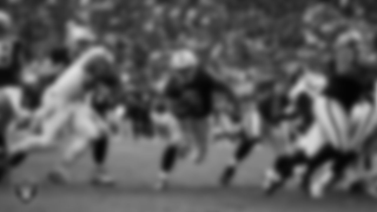 Las Vegas Raiders running back Ashton Jeanty (2) rushes for a 3-yard touchdown during the regular season home game against the Tennessee Titans at Allegiant Stadium.