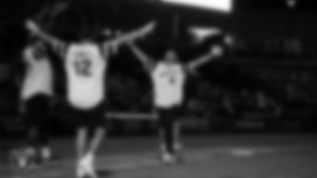 Las Vegas Raiders punter AJ Cole (6) celebrates after tight end Brock Bowers (89) hit a walk-off grand slam in the softball game during the Battle For Vegas at Las Vegas Ballpark.