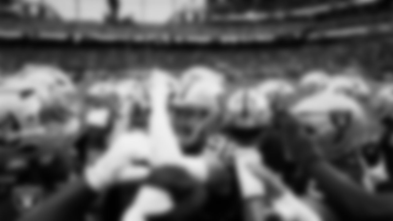 The Las Vegas Raiders huddle before the preseason home game against the San Francisco 49ers at Allegiant Stadium.