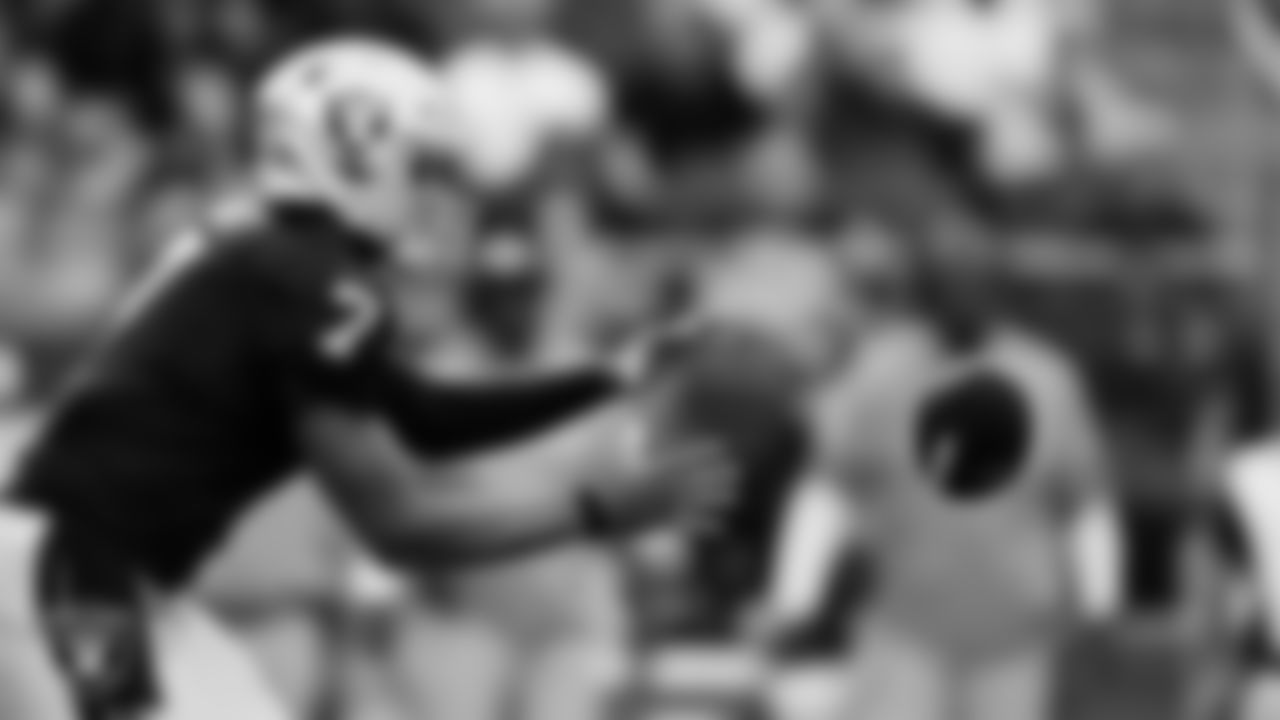Las Vegas Raiders quarterback Geno Smith (7) receives the snap during the regular season home game against the Tennessee Titans at Allegiant Stadium.