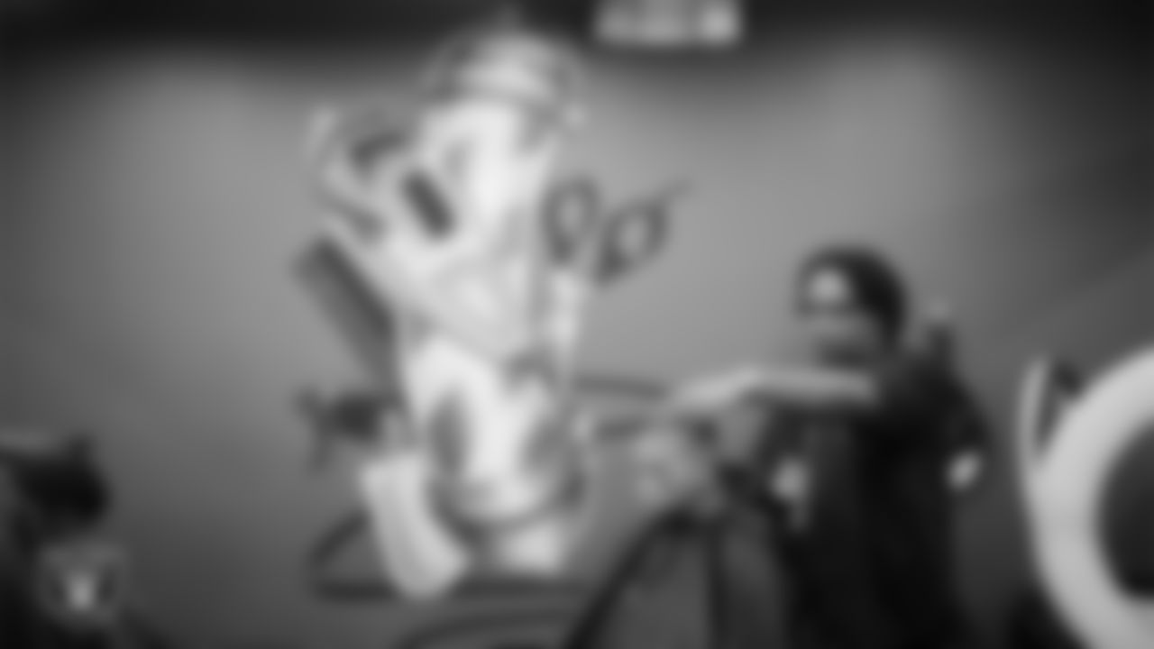 An attendee gets a haircut during the Las Vegas Raiders 4th annual Back-To-School Free Haircuts and Beautician Services event at Expertise Cosmetology Barber School.