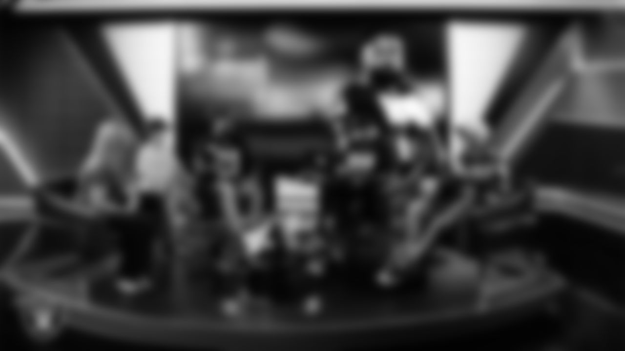 Las Vegas Raiders running back Raheem Mostert (31) works with representatives from Candlelighters Childhood Cancer Foundation and designers to design cleats for My Cause My Cleats in Cox Studios at Intermountain Health Performance Center.