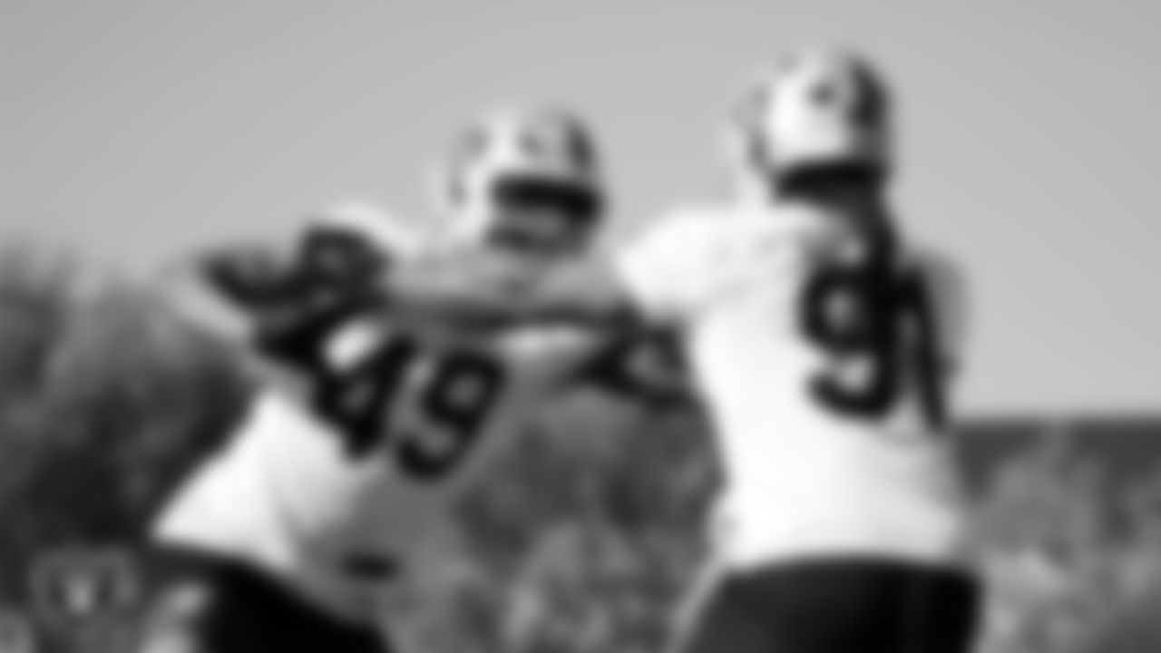 Las Vegas Raiders defensive end Charles Snowden (49) and defensive end Jahfari Harvey (91) during practice at Intermountain Health Performance Center.