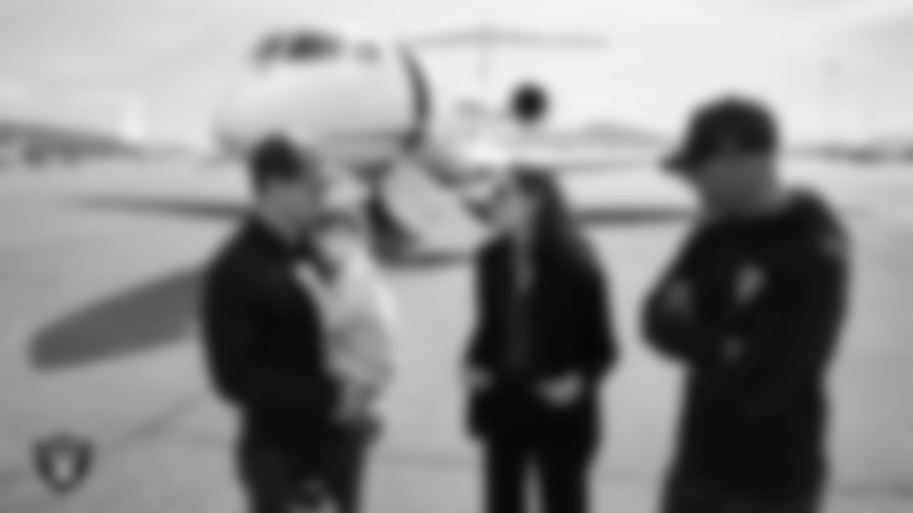 Las Vegas Raiders General Manager John Spytek and his wife Kristen Spytek greet Head Coach Klint Kubiak as he and his family arrive in Henderson.