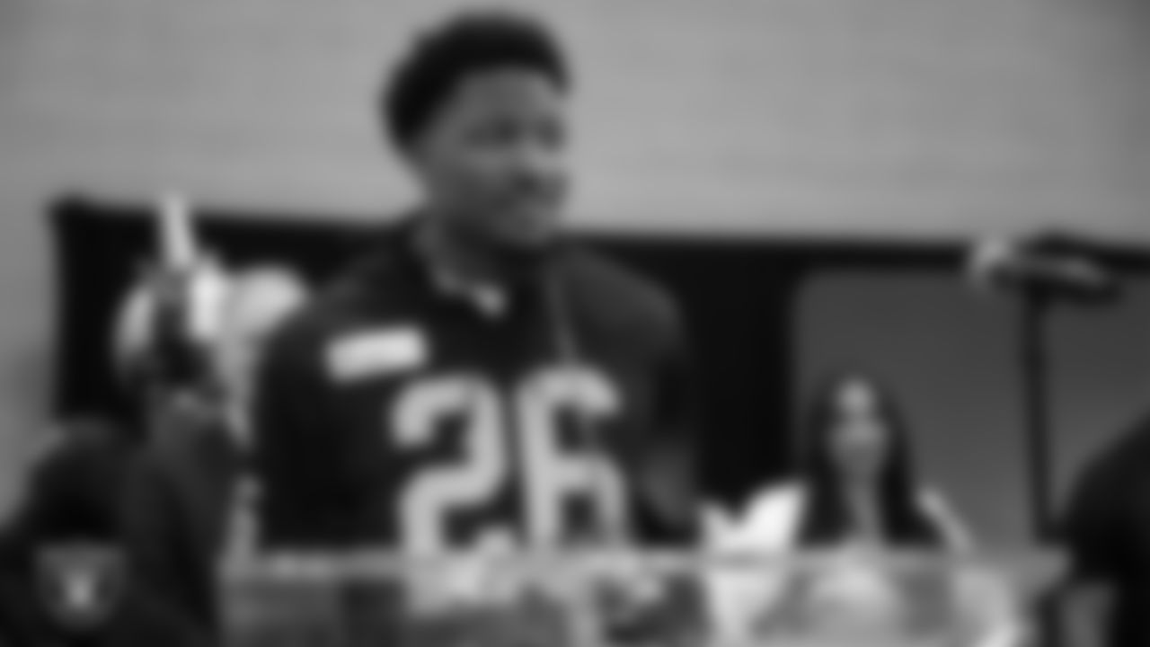 Las Vegas Raiders cornerback Sam Webb (26) speaks to guests during the NFL Green's Super Kids-Super Sharing event at the Pearson Community Center.