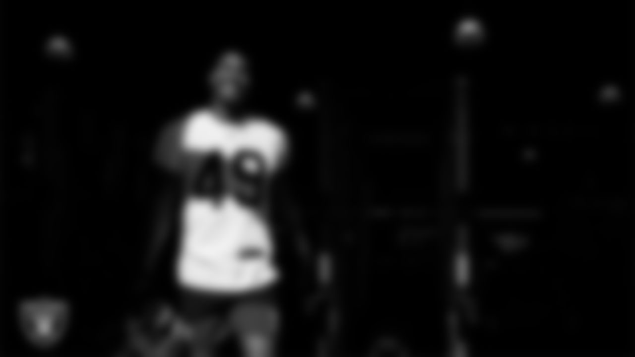 Las Vegas Raiders defensive end Charles Snowden (49) walks out to the field for practice at Intermountain Health Performance Center.