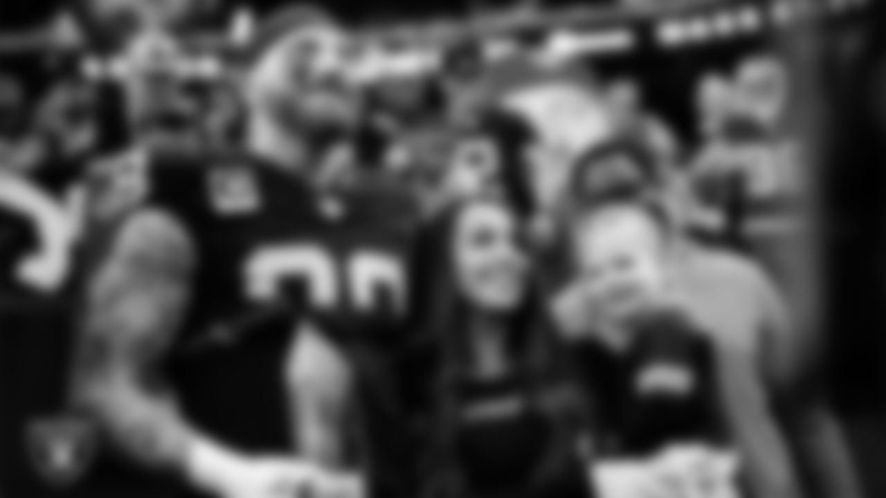 Las Vegas Raiders defensive end Maxx Crosby (98) is awarded the nomination as the Raiders' Walter Payton Man of the Year Award before the regular season home game against the Denver Broncos at Allegiant Stadium.