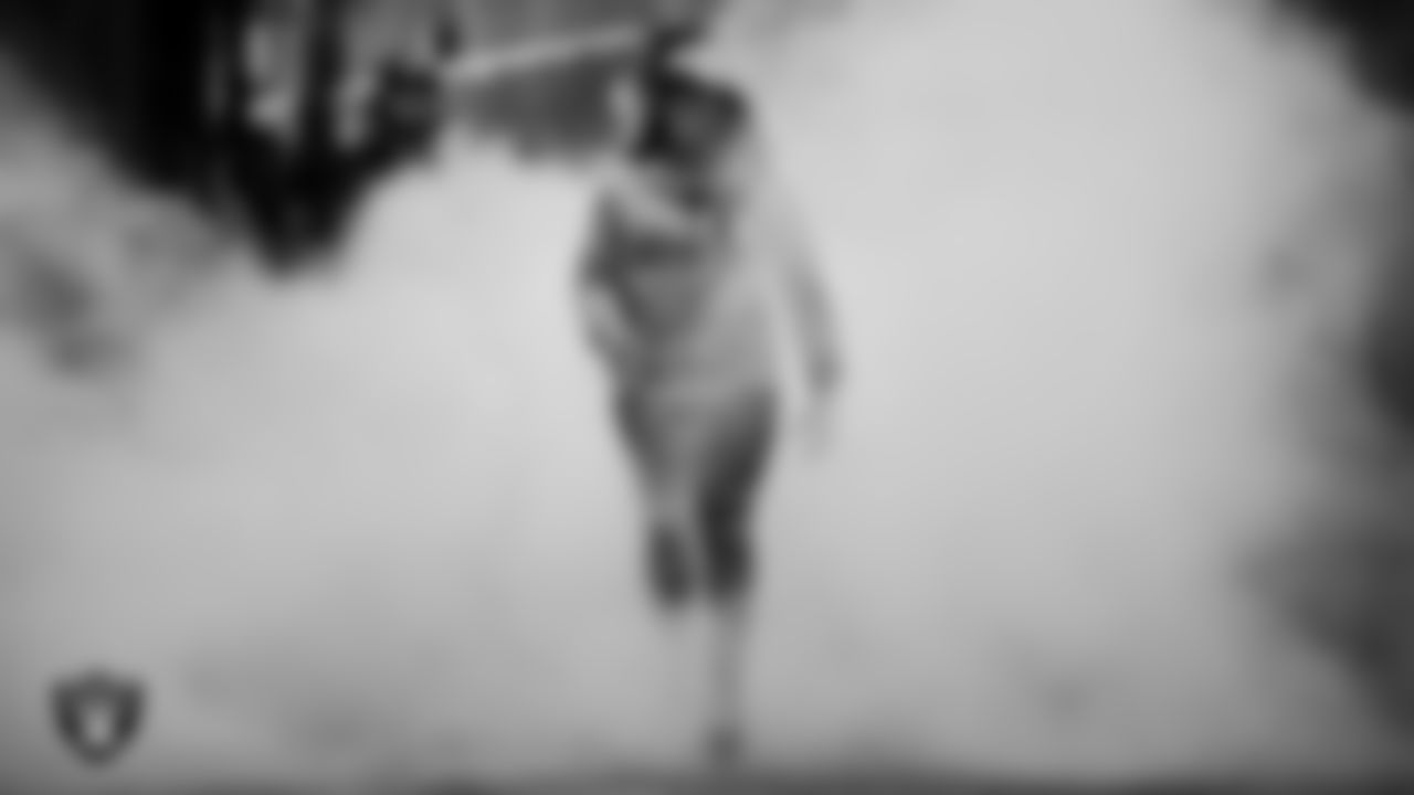 United States Air Force veteran Sherisha Ko is honored during a Salute to Service moment during the regular season home game against the Denver Broncos at Allegiant Stadium.