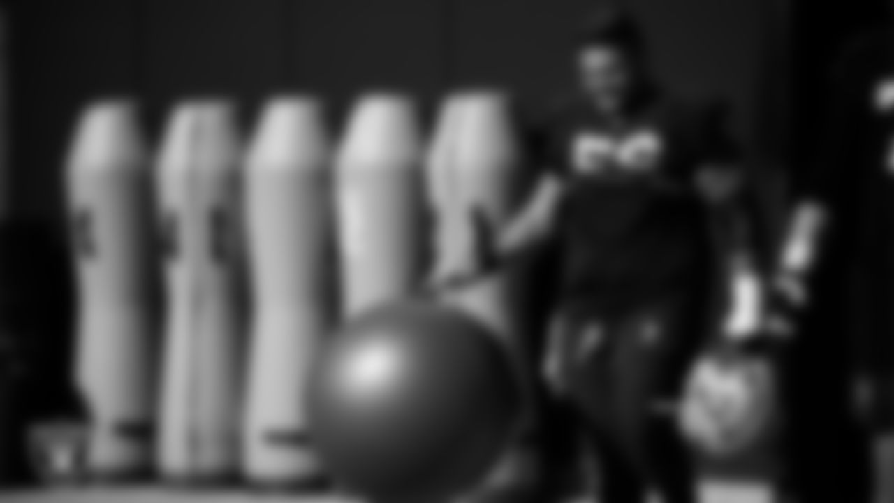 Las Vegas Raiders guard Atonio Mafi (56) walks out to the field for practice at Intermountain Health Performance Center.