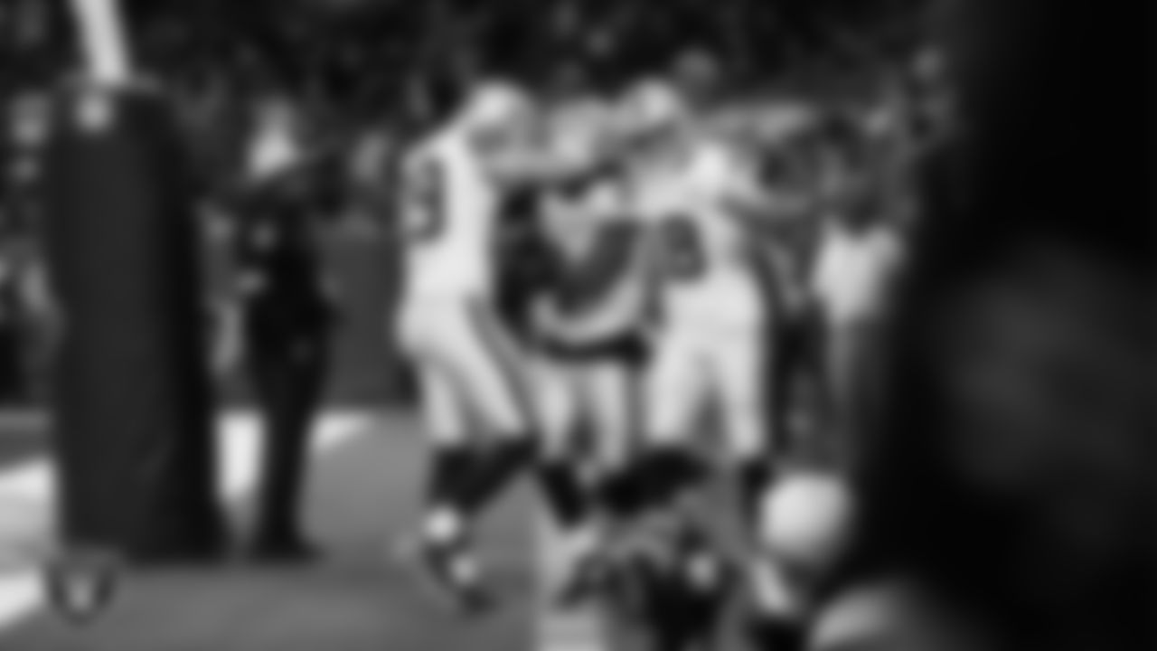 Las Vegas Raiders running back Ashton Jeanty (2) celebrates with teammates after rushing for a 51-yard touchdown during the regular season away game against the Houston Texans at NRG Stadium.