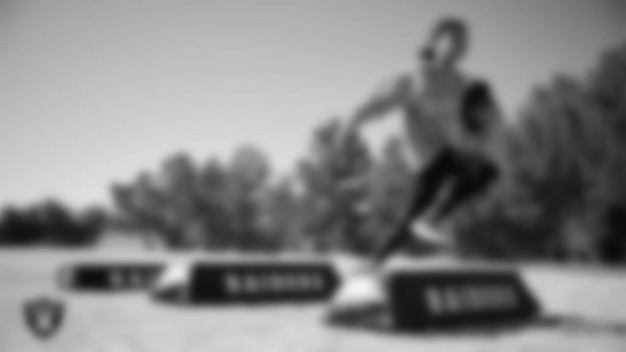 A student goes through a drill during a Raiders Junior Training Camp at Kitty Ward Elementary School.