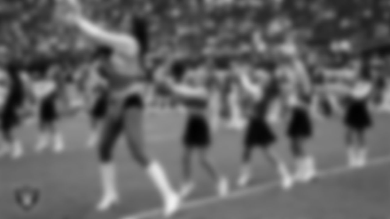 Raiderette Meekela and Junior Raiderettes perform on the field before the preseason home game against the San Francisco 49ers at Allegiant Stadium.