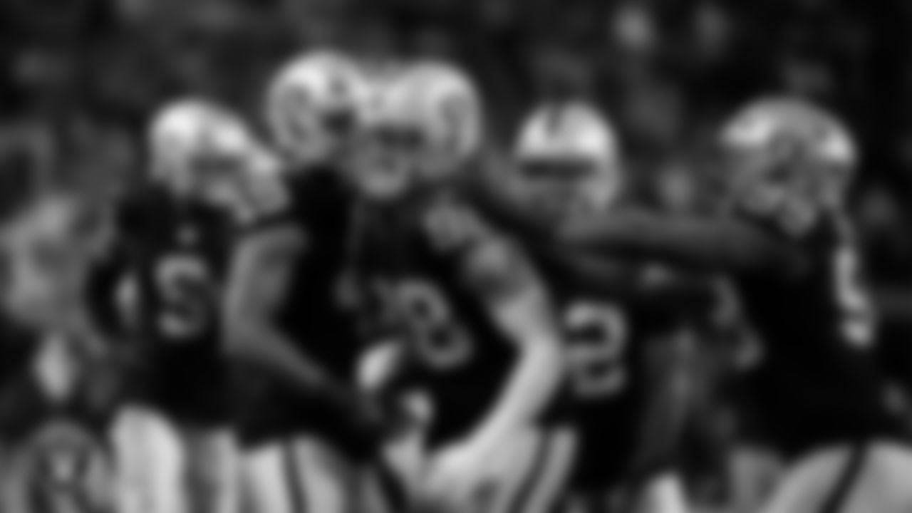 Las Vegas Raiders defensive end Maxx Crosby (98) celebrates with teammates after forcing a fumble during the regular season home game against the Dallas Cowboys at Allegiant Stadium.