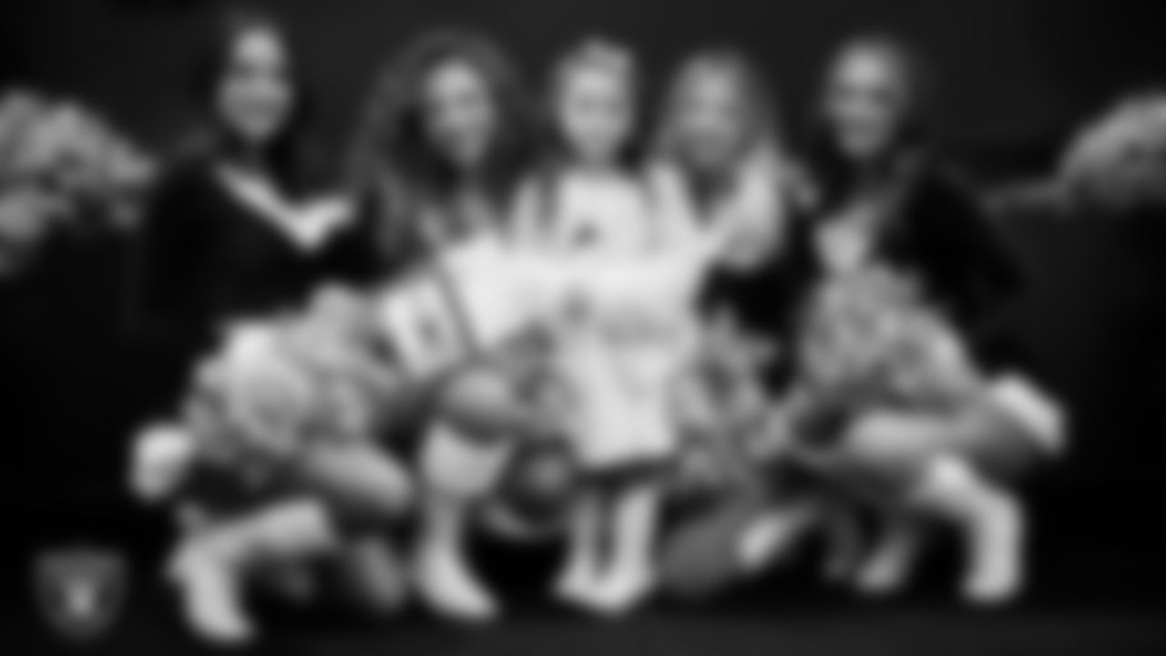 Raiderettes pose for a photo with a Junior Raiderette during the Junior Raiderettes Banquet at The Studio.