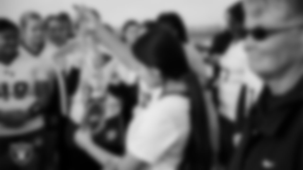 A member of the Pahrump Valley High School flag football team looks at the MVP chain before their game at Sierra Vista High School.