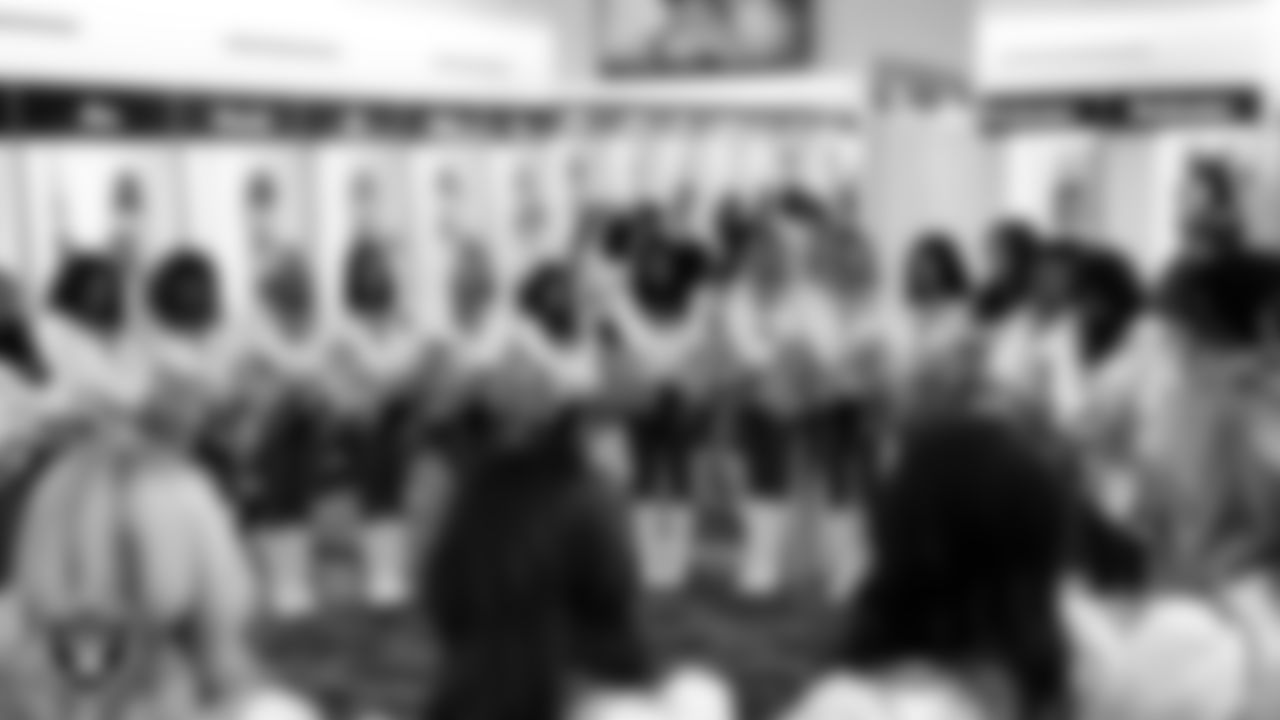 The Raiderettes huddle in the locker room before the regular season home game against the Tennessee Titans at Allegiant Stadium.