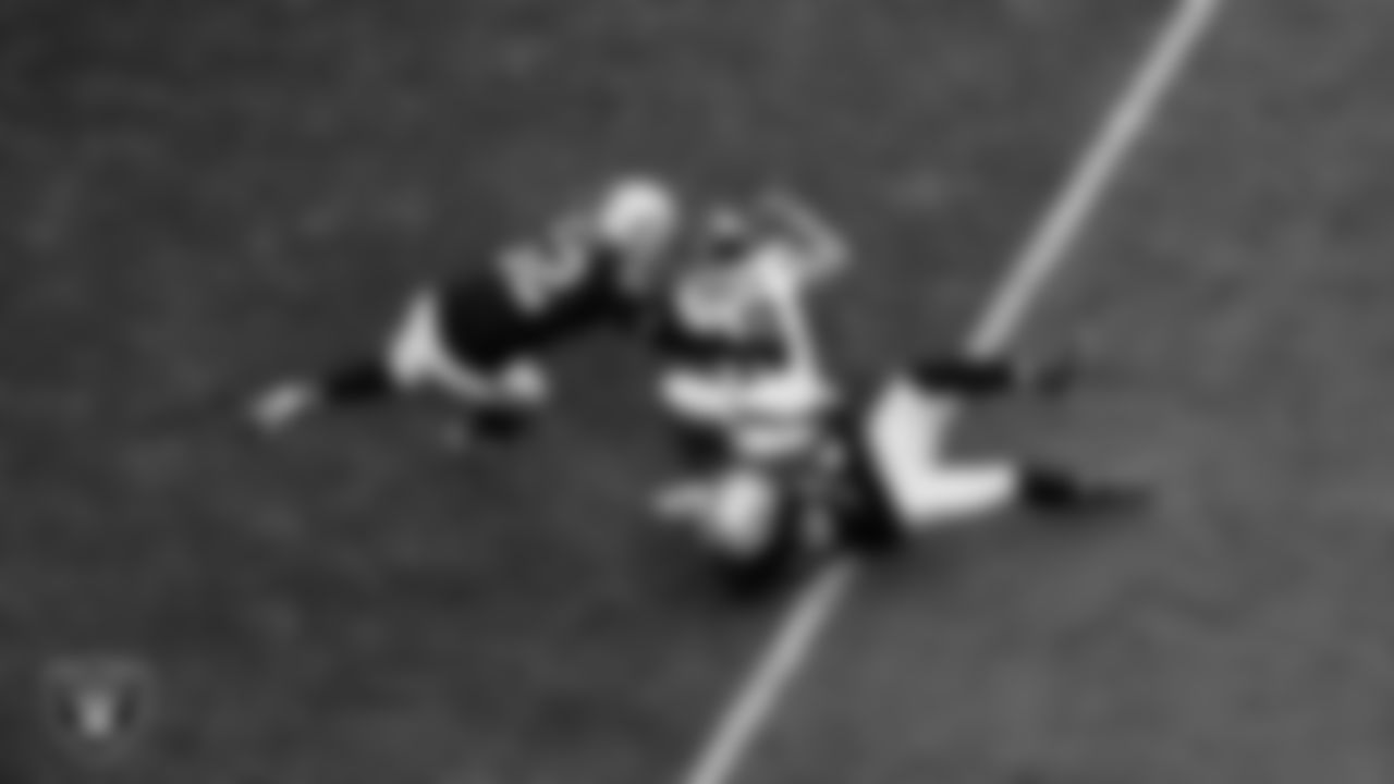 Las Vegas Raiders linebacker Elandon Roberts (52) and safety Lonnie Johnson Jr. (32) during the regular season home game against the New York Giants at Allegiant Stadium.