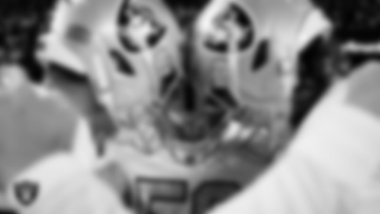 The Las Vegas Raiders special teams unit huddles before the regular season away game against the Denver Broncos at Empower Field at Mile High.