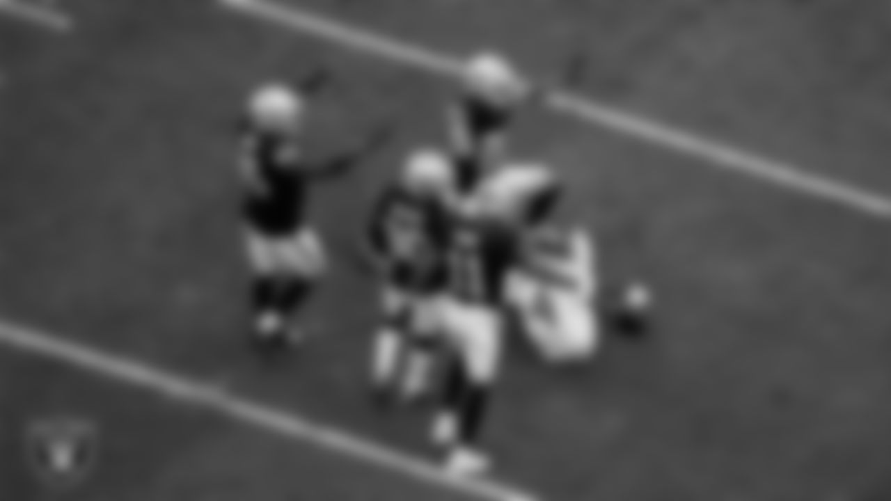 Las Vegas Raiders linebacker Devin White (45), cornerback Darnay Holmes (30), safety Jeremy Chinn (11) and safety Isaiah Pola-Mao (20) celebrate on the field during the regular season home game against the Tennessee Titans at Allegiant Stadium.