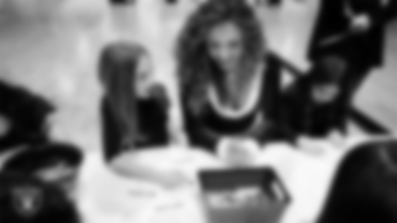 Raiderette Lexie and a Junior Raiderette enjoy activities during the Junior Raiderettes Banquet at The Studio.