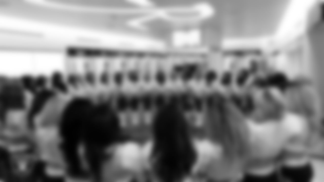 The Raiderettes huddle in the locker room before the preseason home game against the San Francisco 49ers at Allegiant Stadium.