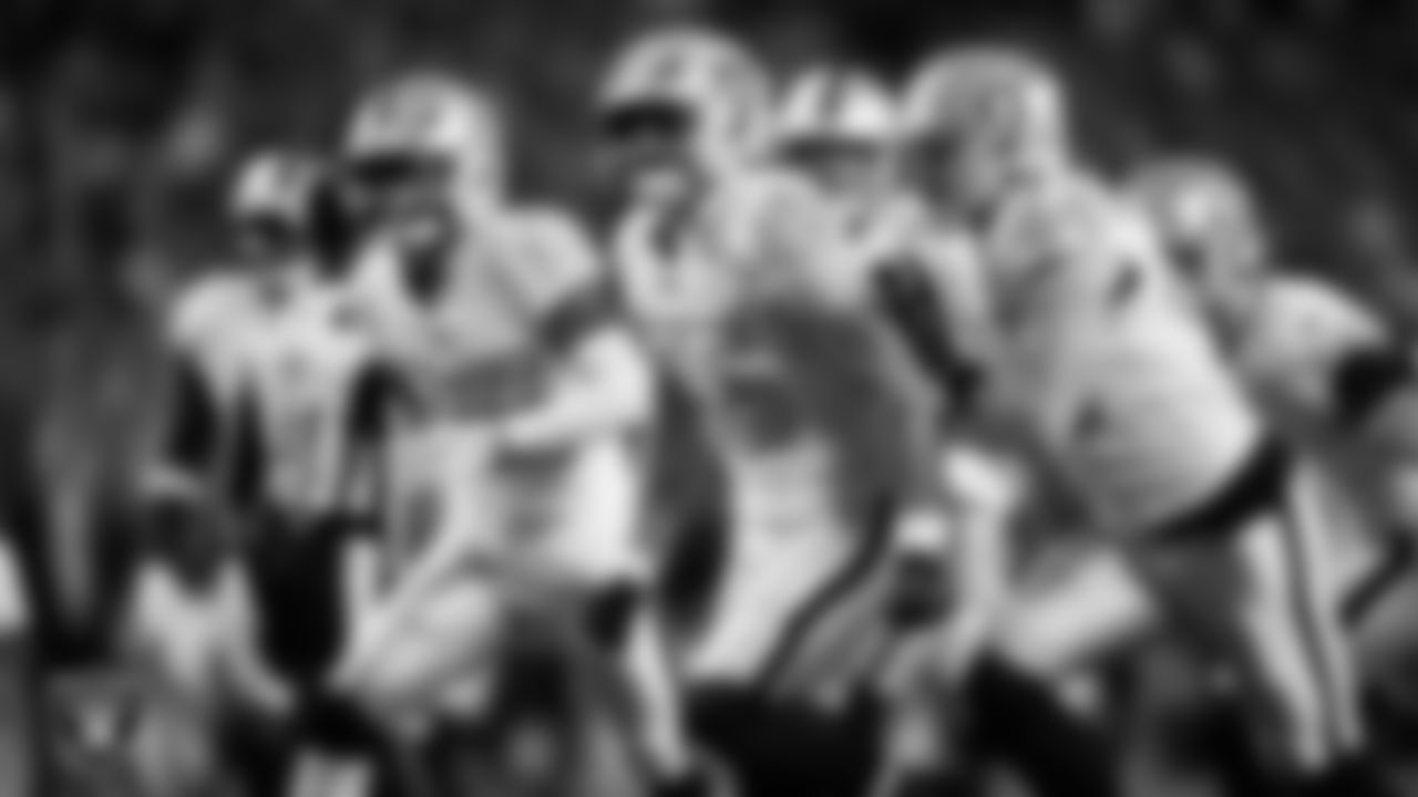 Las Vegas Raiders linebacker Cody Lindenberg (55) celebrates with teammates after making a tackle during the regular season away game against the Denver Broncos at Empower Field at Mile High.