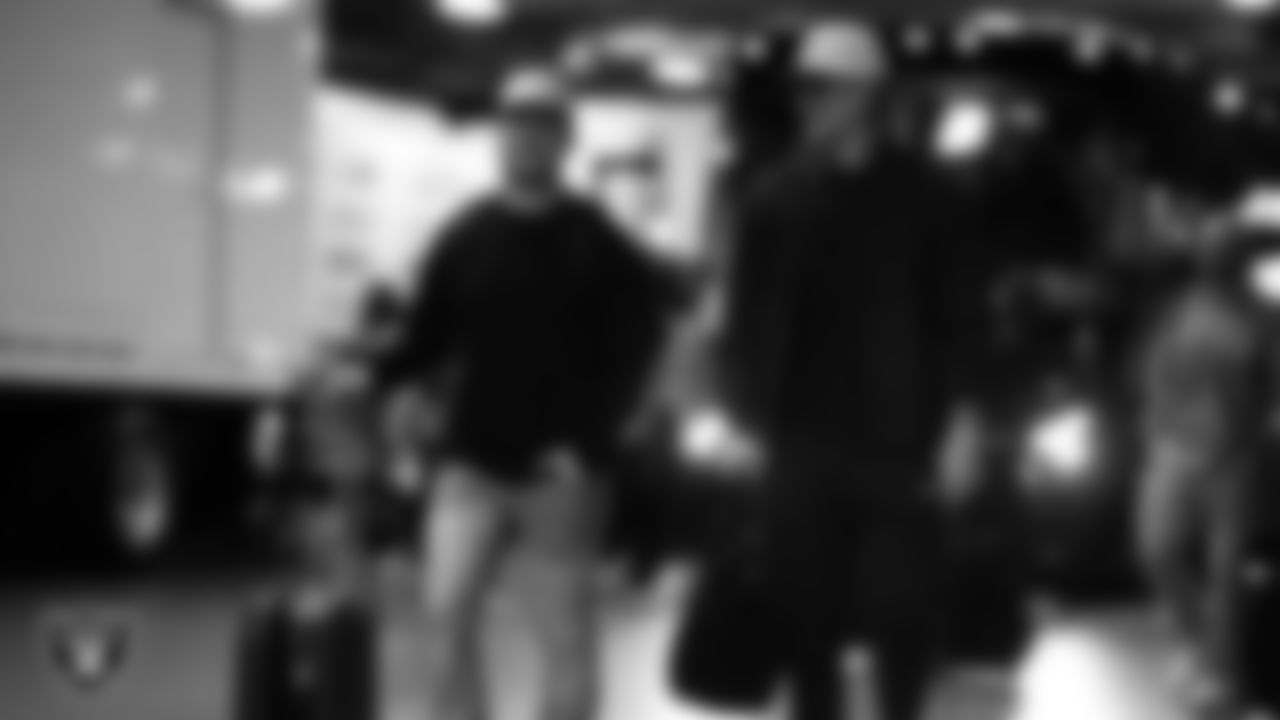 Las Vegas Raiders running back Dylan Laube (23) and quarterback Kenny Pickett (15) arrive to the regular season away game against the Denver Broncos at Empower Field at Mile High.