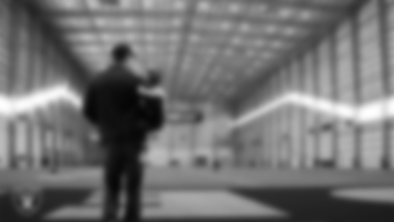 Las Vegas Raiders Head Coach Klint Kubiak and his family on the indoor field at Intermountain Health Performance Center.