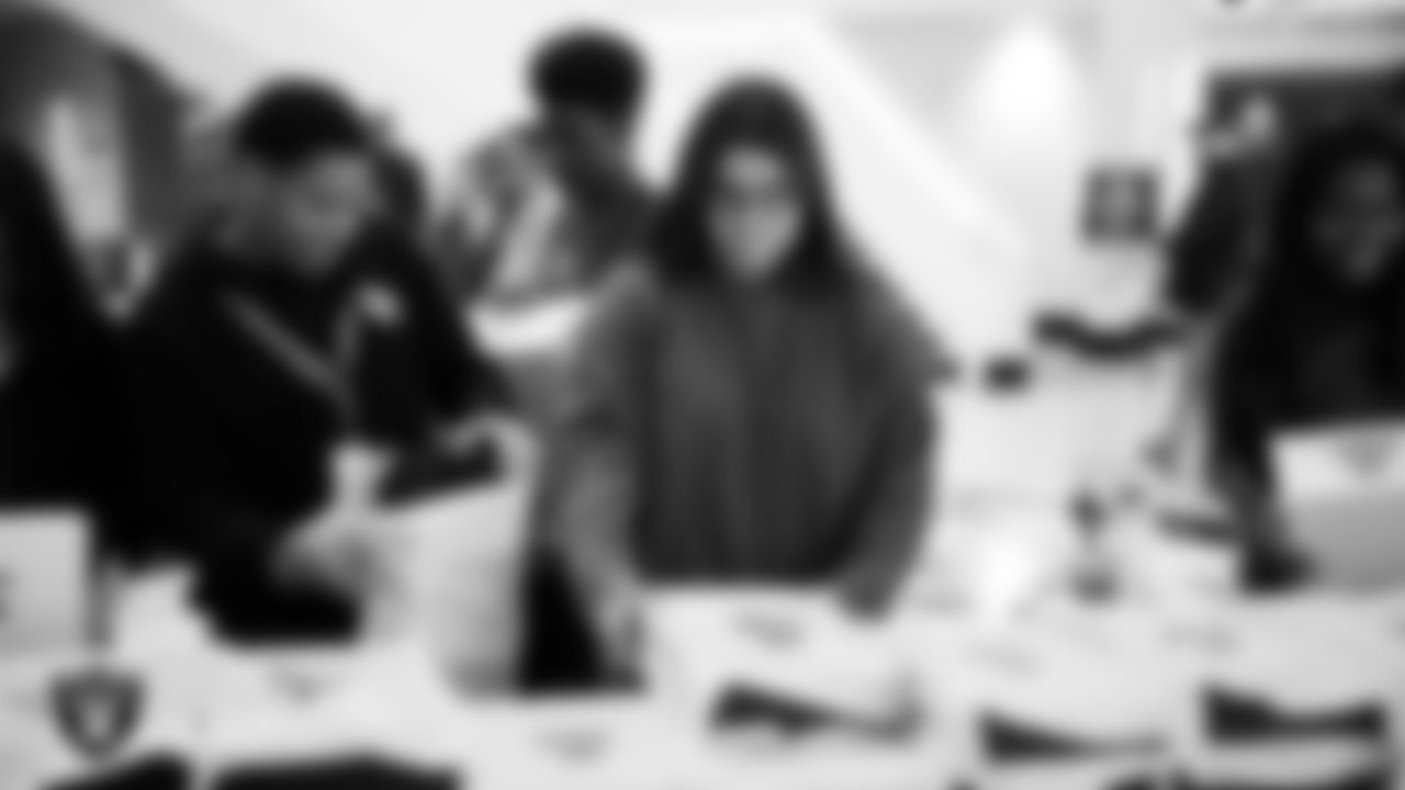 Canyon Springs High School students receive Las Vegas Raiders gear after the Employee Resource Group Mentorship Program at Las Vegas Raiders Headquarters.