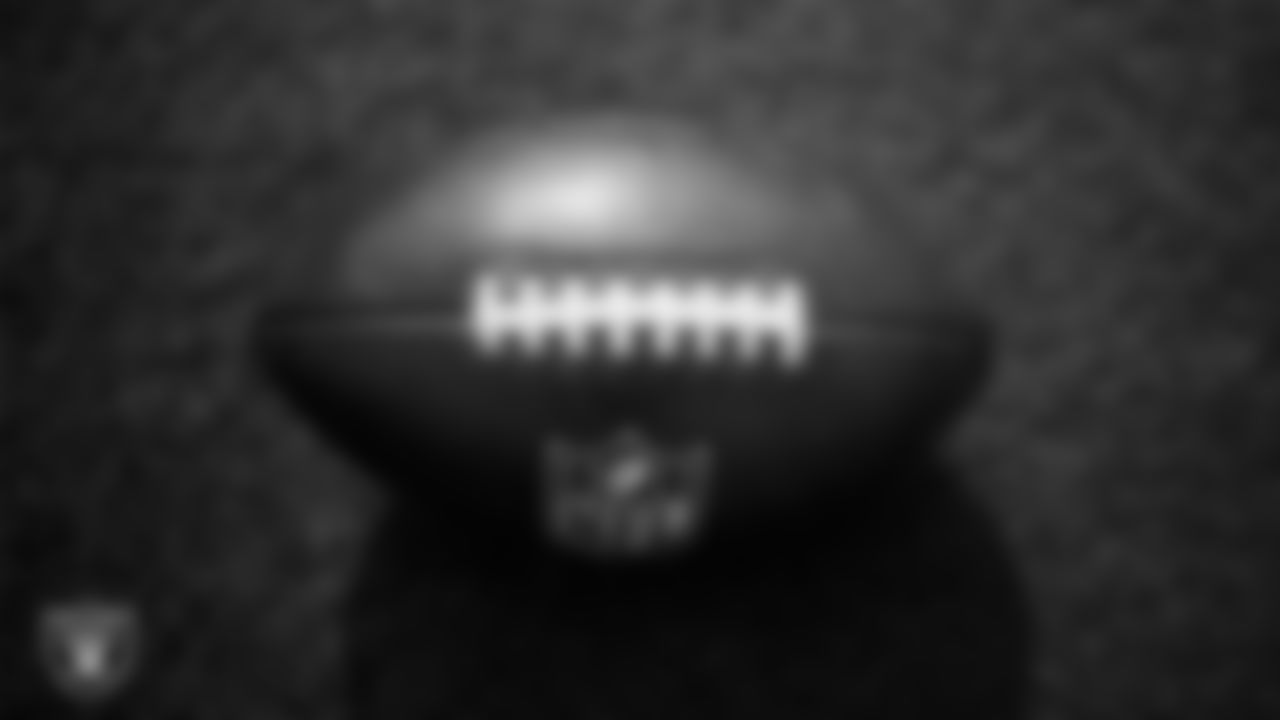 A football on the field during practice at Intermountain Health Performance Center.