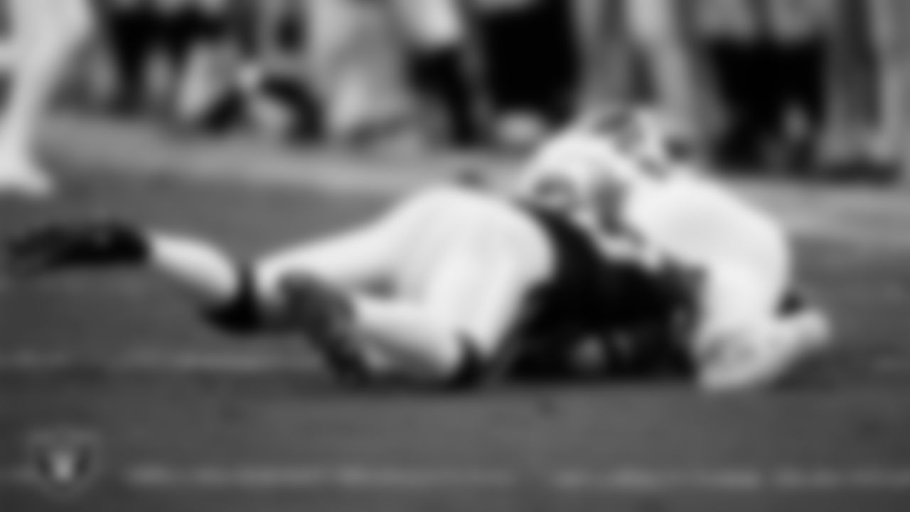 Las Vegas Raiders linebacker Jamal Adams (33) makes a tackle during the regular season home game against the Tennessee Titans at Allegiant Stadium.