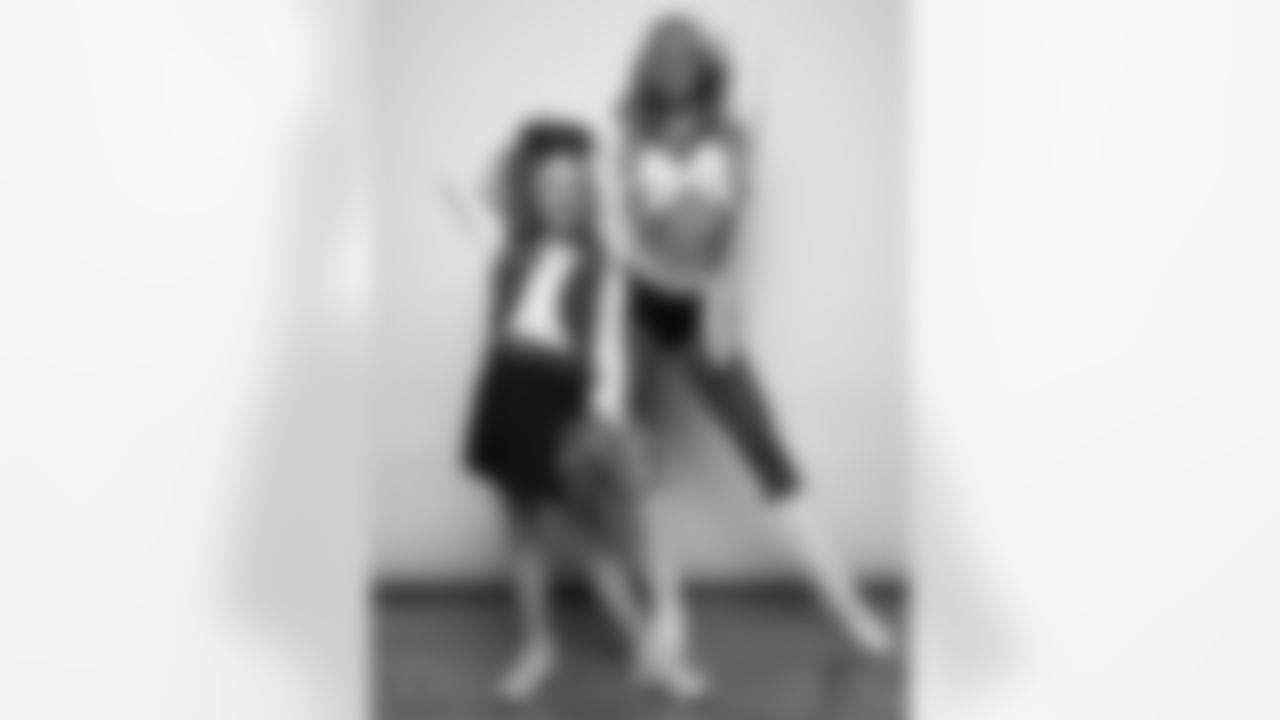 Raiderette Hayley poses for a photo with a Junior Raiderette during 2025 Media Day at The Studio.