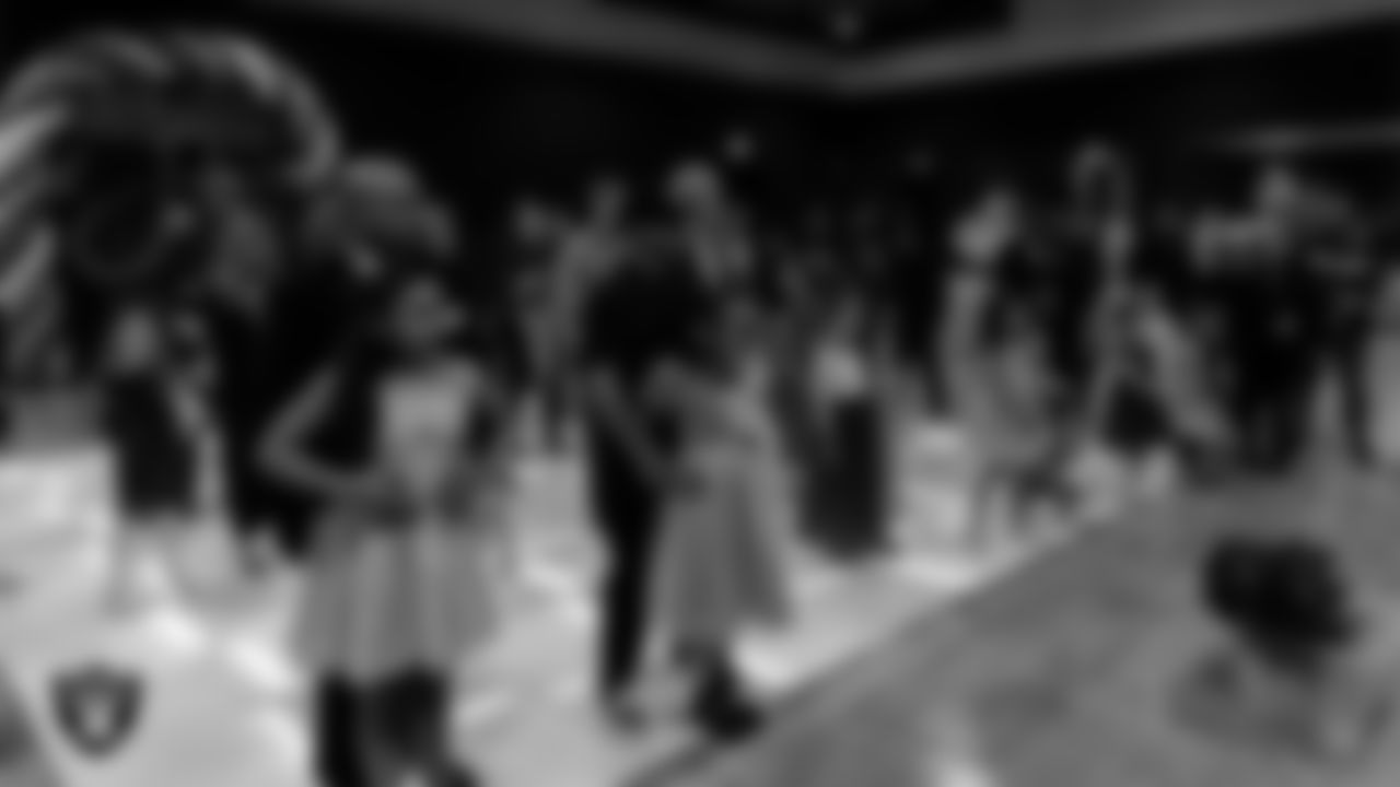 Attendees gather for a rose exchange during the Valentine's Day Dance at The Studio.