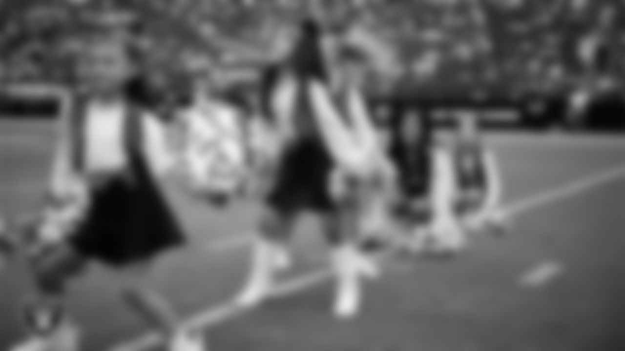 Junior Raiderettes perform on the field before the preseason home game against the San Francisco 49ers at Allegiant Stadium.