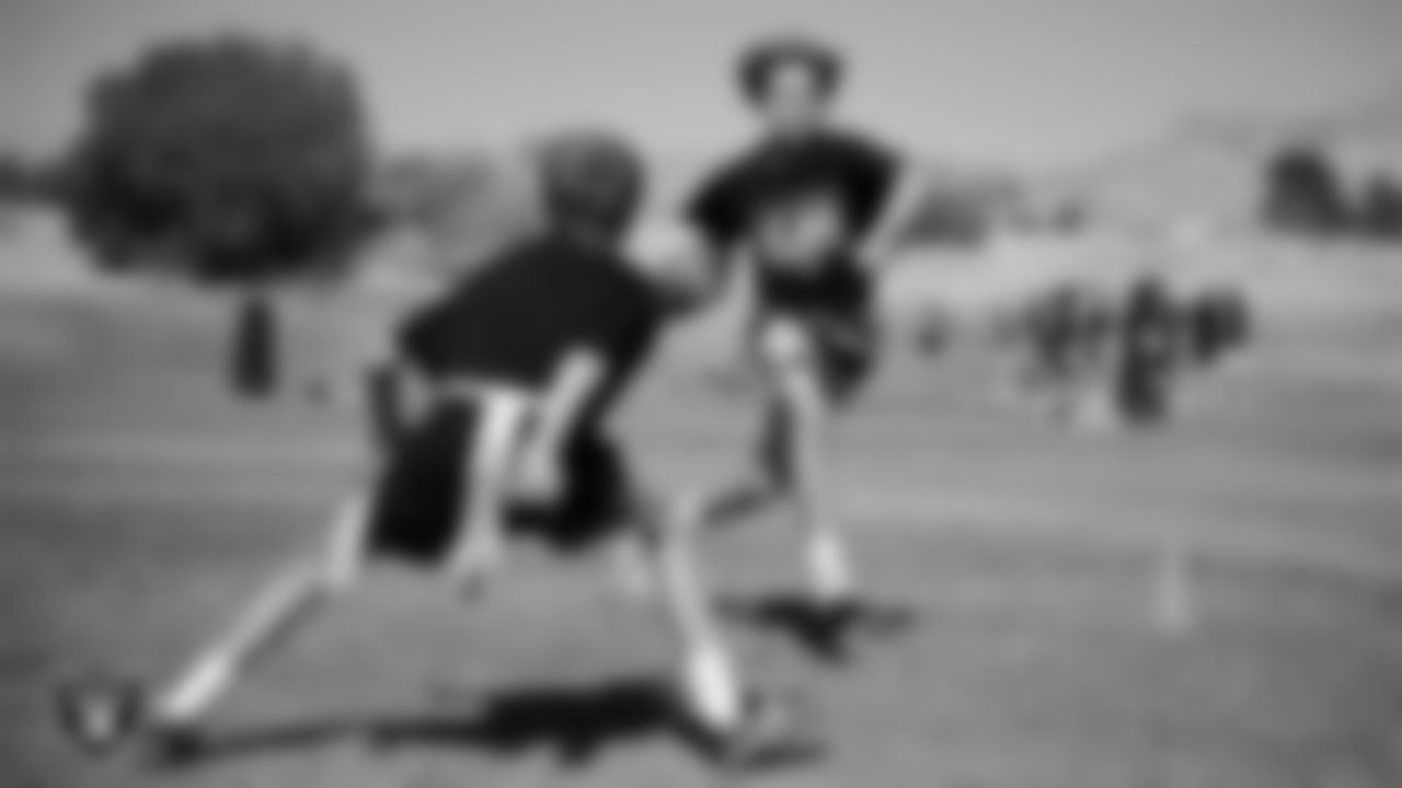 Athletes take part in a drill after a partnership announcement between the Las Vegas Raiders and Clark County School District as a Silver and Black Flag Football league at the middle school level at Sig Rogich Middle School.