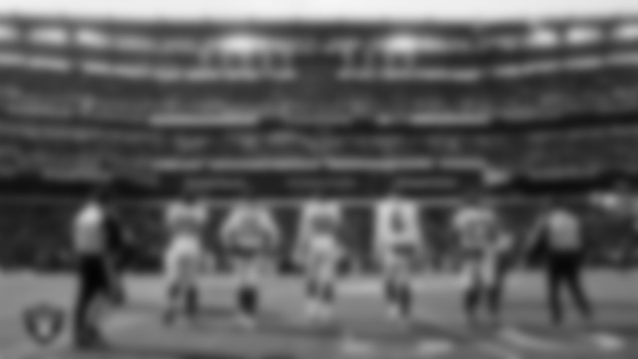 The Las Vegas Raiders walk out to the center of the field for the coin toss before the regular season away game against the the Philadelphia Eagles at Lincoln Financial Field.