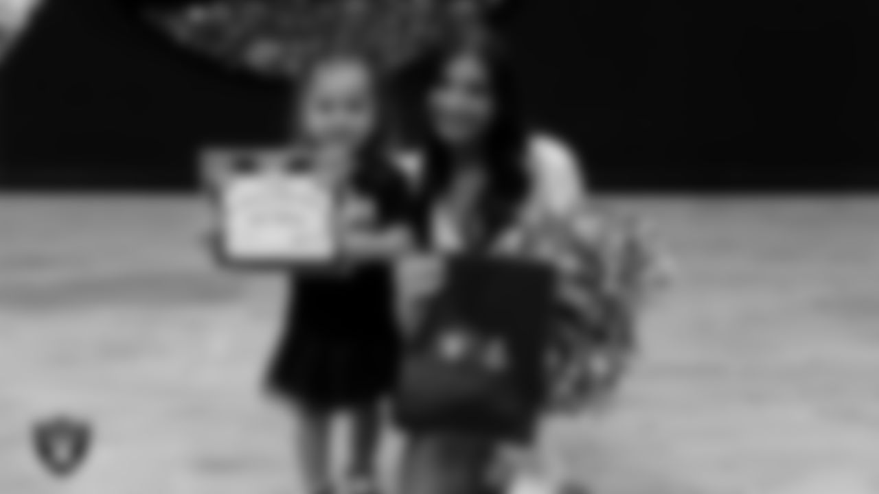 Raiderette Maddie poses for a photo with a Dancer of the Week during day three of summer camp at The Studio.