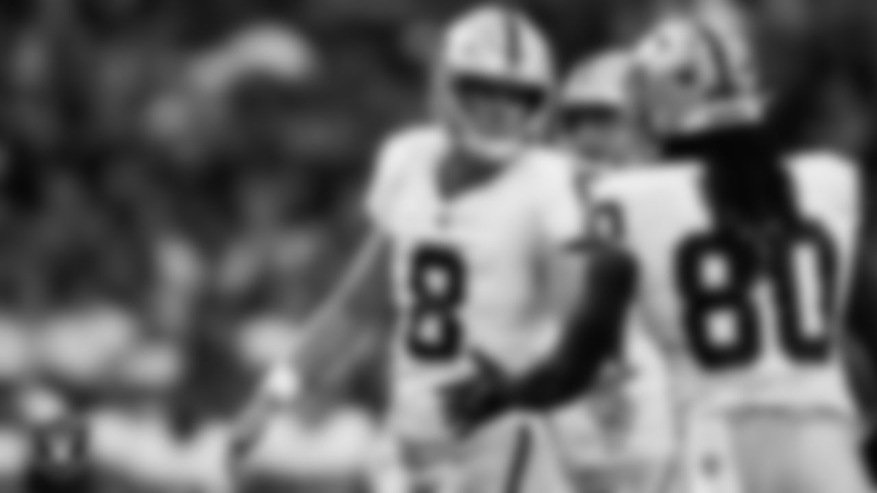 Las Vegas Raiders kicker Daniel Carlson (8) celebrates with tight end Ian Thomas (80) after kicking a 27-yard field goal during the preseason away game against the Seattle Seahawks at Lumen Field.