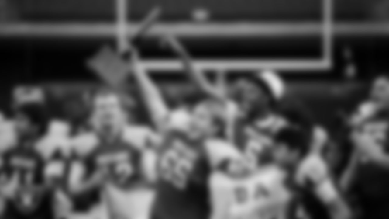 The Needles High School football team celebrates after defeating Pershing County High School in the NIAA 2A Division State Championship game at Allegiant Stadium.